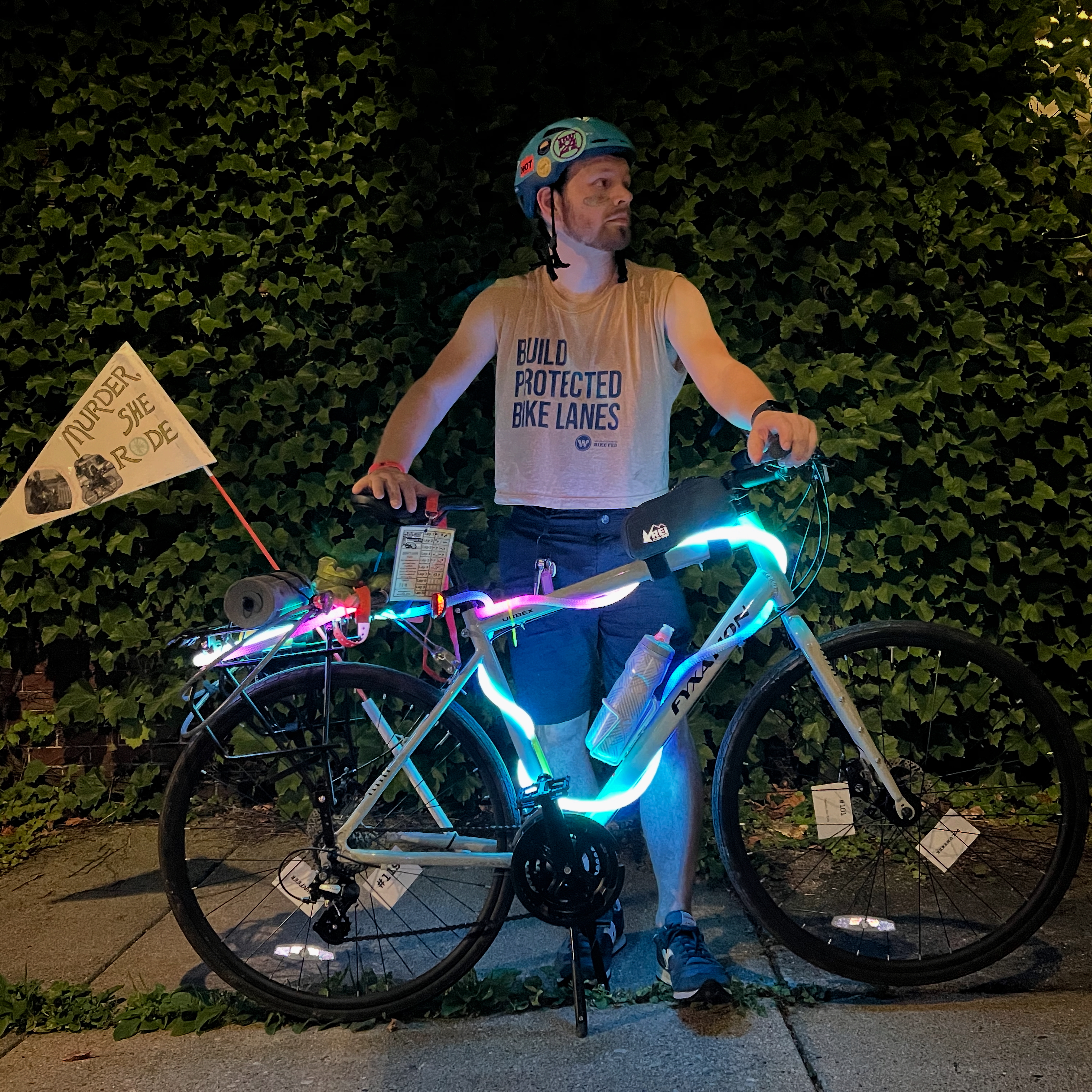 Me, at Milwaukee&rsquo;s Riverwest 24 bike race, wearing a &lsquo;Build Protected Bike Lanes&rsquo; crop top from the Bike Fed. Milwaukee is building a lot of them (PBLs, not crop tops) these days!